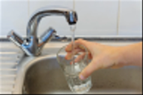 Person filling up a glass of tap water - Photo, Image