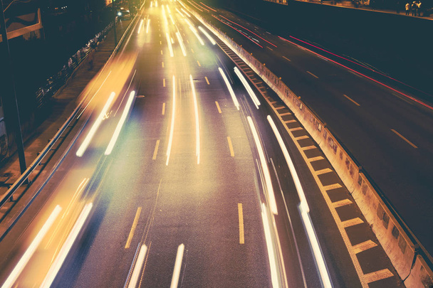 Night car city raffic. Motion blur car on the highway in big modern city. - Foto, Bild