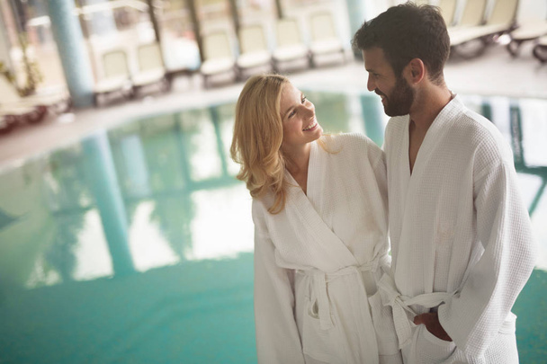 Portrait of attractive cheerful couple in spa center - Photo, image