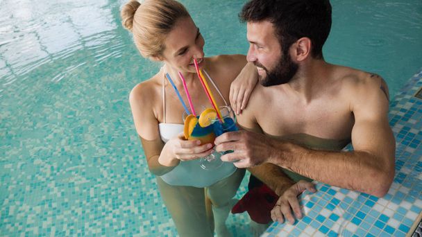 couple relaxing in swimming pool - Photo, image