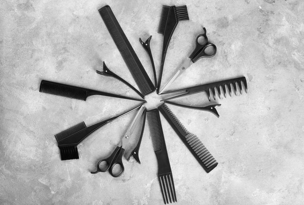 Flat lay composition with set of hairdresser's tools on grey background - Valokuva, kuva