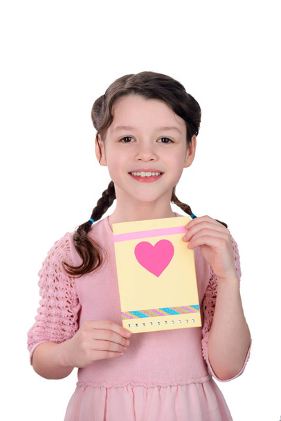 Girl showing a greeting card - Foto, immagini