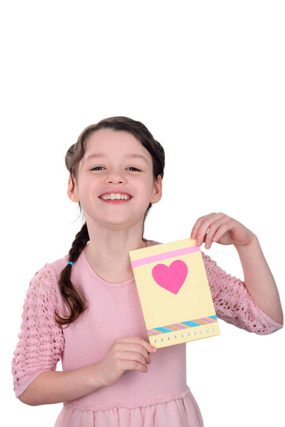 Young lady showing handmade card - Foto, immagini