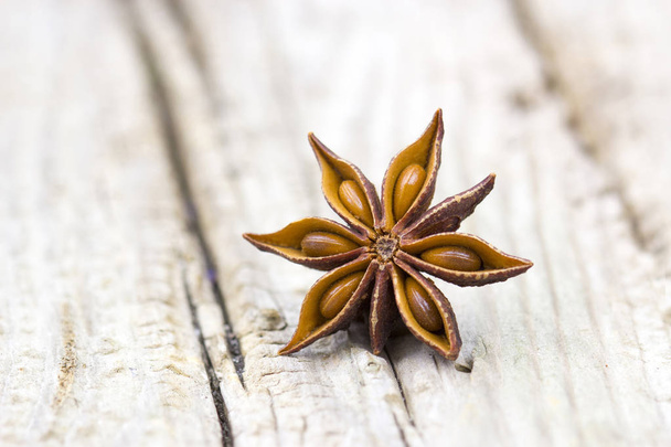 star anise on wooden background, close up - Photo, Image
