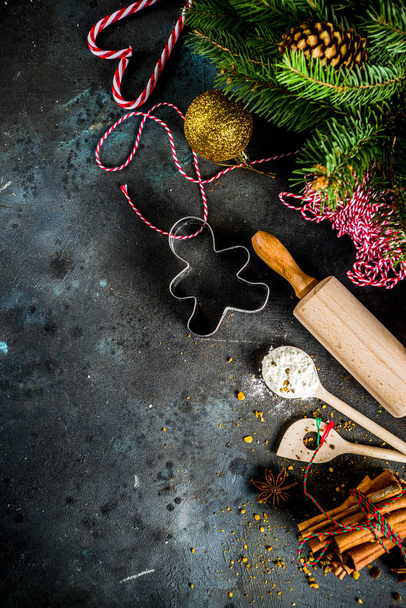 Christmas bakery background, with baking utensils, flour, spices and decorations, dark concrete table, copy space top view - Fotoğraf, Görsel