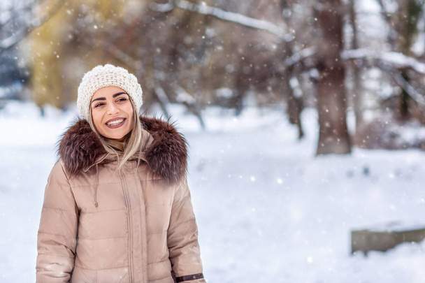 winter holidays, Christmas and people concept  Attractive young woman in wintertime outdoor - Photo, Image