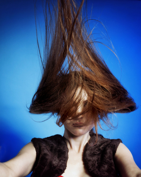 Fashion model with hair blowing in the wind - Фото, зображення