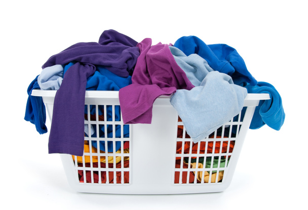 Colorful clothes in laundry basket. Blue, indigo, purple. - Photo, Image