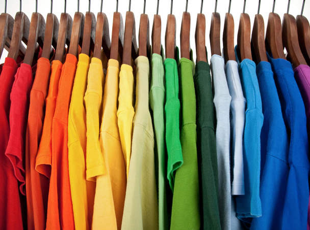 Colors of rainbow, clothes on wooden hangers - Photo, Image