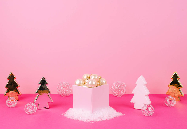 Christmas tree balls on a pink background. - Fotó, kép