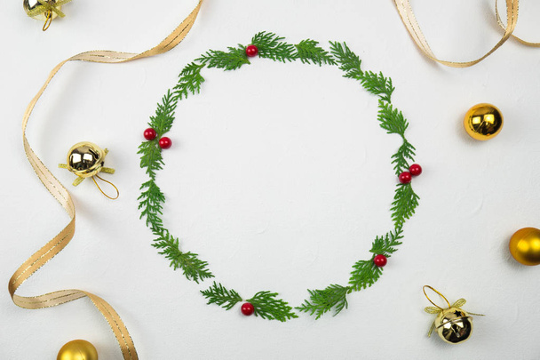 Creative Christmas layout. Christmas wreath on white background whit copy space. Border arrangement. Flat lay top view.  - Zdjęcie, obraz