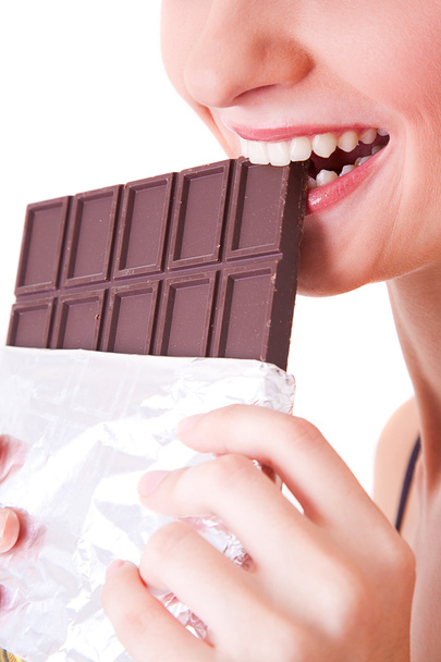 woman biting chocolate bar - Foto, Imagen