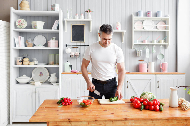 The chef cuts vegetables. The concept of eco-friendly products for cooking - Valokuva, kuva