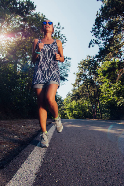 Woman fitness jogging workout wellness concept - Foto, Imagen