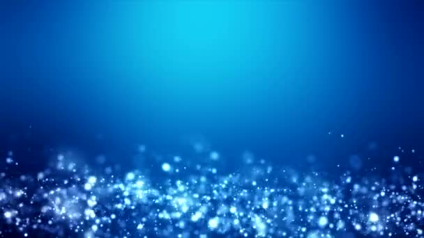 Video animation of christmas light shine particles bokeh over blue background - holiday concept - Footage, Video