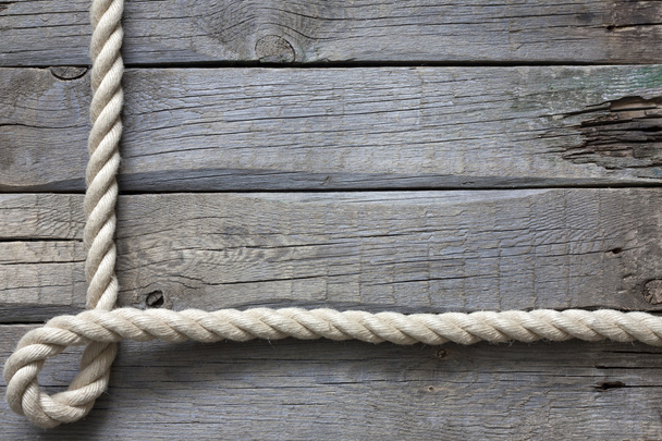 touw op oude vintage houten planken abstracte achtergrond - Foto, afbeelding