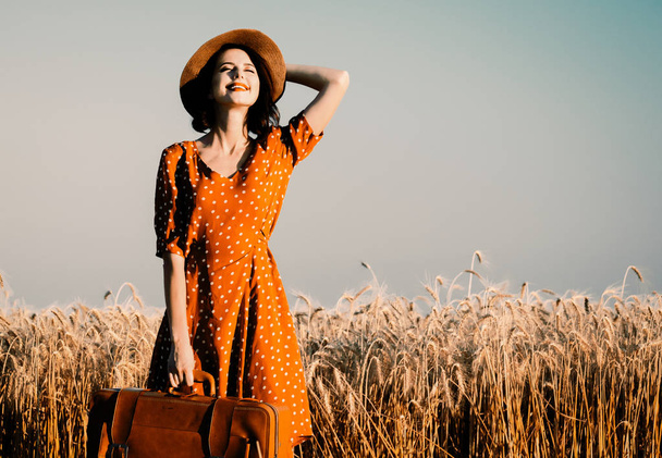 young woman with suitcase - 写真・画像