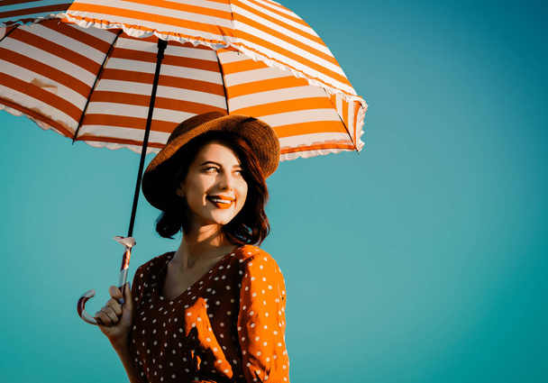 young woman with umbrella - Photo, image