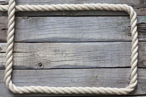 Rope on old vintage wooden planks abstract background - Фото, изображение