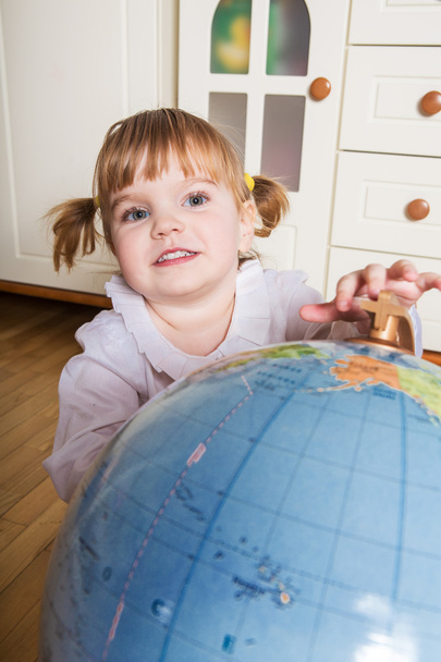 Child with a globe - Photo, image