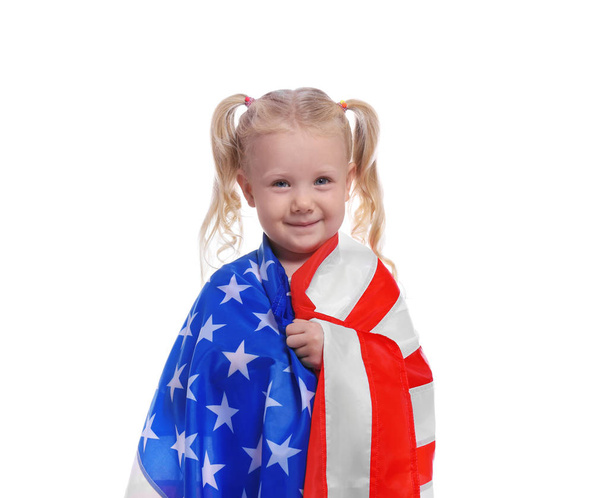 Portrait of cute little girl with American flag on white background - Foto, immagini
