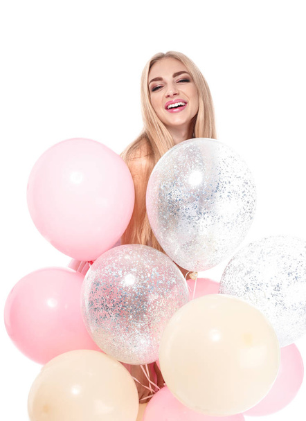 Hermosa joven con globos de aire sobre fondo blanco
 - Foto, imagen