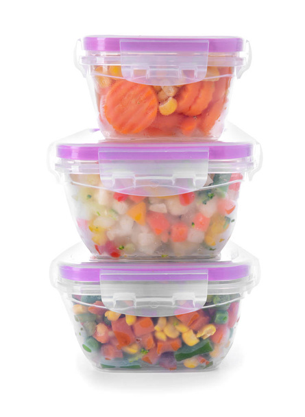 Plastic containers with frozen vegetables on white background - Photo, Image