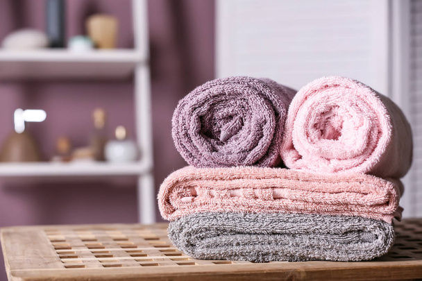 Clean soft towels on table in bathroom - Photo, Image