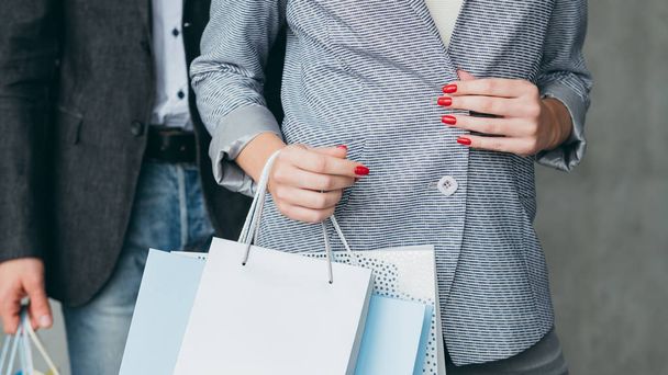 shopping presents man woman multiple bags hands - Фото, изображение