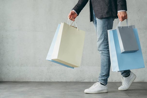 shopping addict consumerism lifestyle man walk bag - Foto, imagen