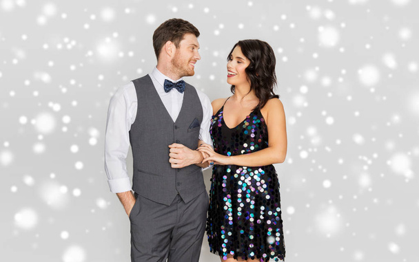 happy couple in festive clothes talking - Foto, Imagem
