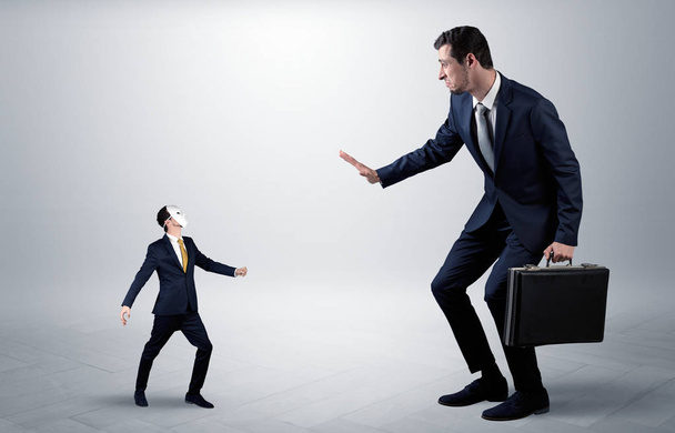 Conflict between small and big businessman - 写真・画像