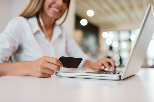 E-commerce concept. Woman making online payment  - Фото, изображение