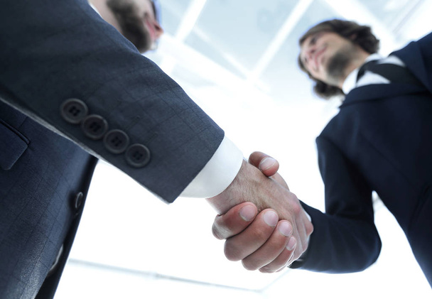 Photo of handshake of two happy businessmen - Foto, afbeelding