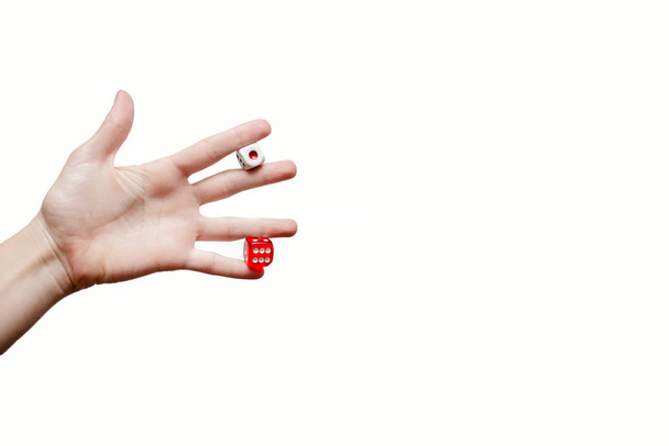 Female hand holding a dice. Luck and chances Concept. European, hands, white abstrack background. isolated close up. - Foto, Imagem