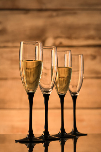 Glasses with champagne and empty glasses - Φωτογραφία, εικόνα