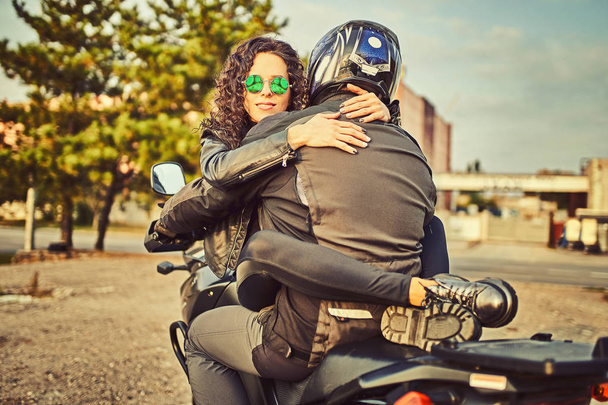 man and sensual woman ride motorbike, adventure concept. Lets go on a new adventure - 写真・画像