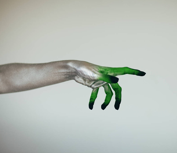 Creepy Halloween monster witch hand with white, green and black in front of white background - Fotoğraf, Görsel