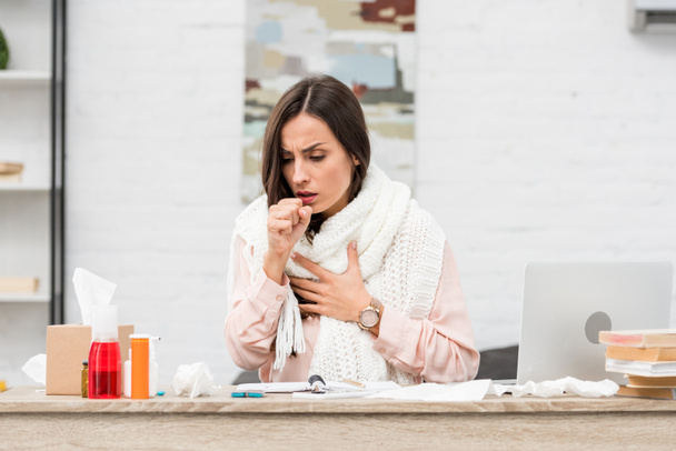 sick young businesswoman having cough at workplace - Foto, immagini