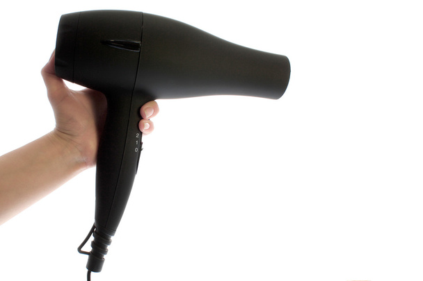 Hairdryer in hand isolated - Foto, Imagen