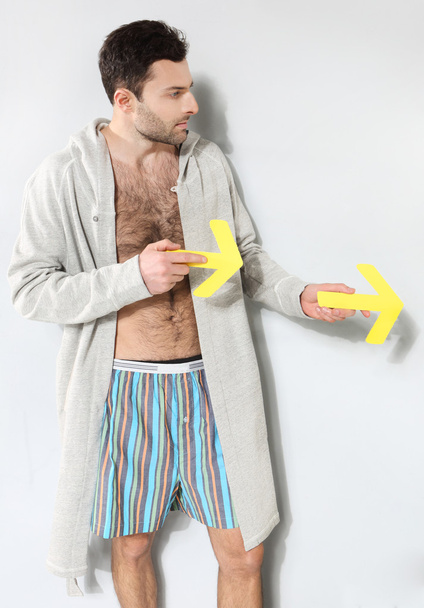 Man holding yellow arrows - Photo, Image