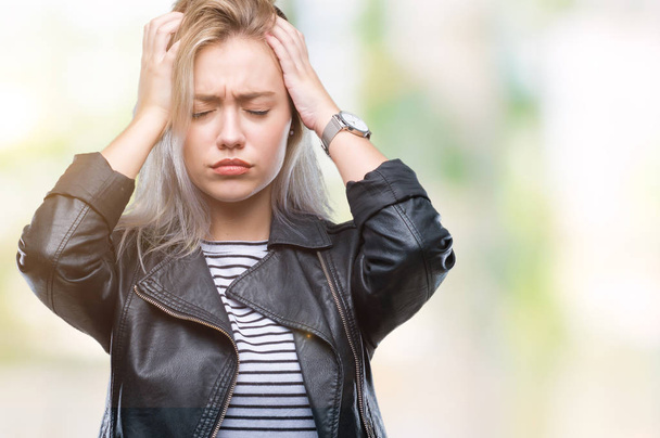 Young blonde woman wearing fashion jacket over isolated background suffering from headache desperate and stressed because pain and migraine. Hands on head. - Fotografie, Obrázek