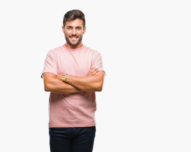 Young handsome man over isolated background happy face smiling with crossed arms looking at the camera. Positive person. - Foto, Bild