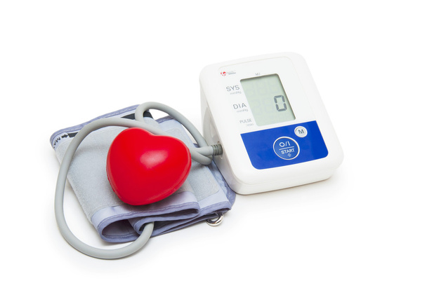 Digital blood pressure meter with love heart symbol on white background - Photo, Image