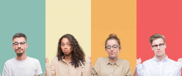 Collage of a group of people isolated over colorful background clueless and confused expression with arms and hands raised. Doubt concept. - Photo, Image