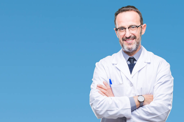 Middle age senior hoary professional man wearing white coat over isolated background happy face smiling with crossed arms looking at the camera. Positive person. - Photo, Image