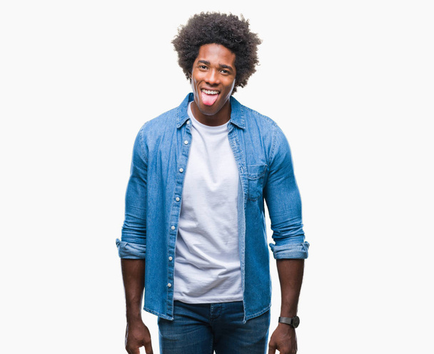 Afro american man over isolated background sticking tongue out happy with funny expression. Emotion concept. - Foto, Imagem