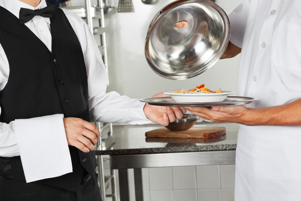 Chef Giving Pasta Dish To Waiter - Zdjęcie, obraz
