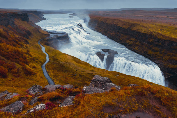 Majestic waterfall Gullfoss  in Iceland in autumn in cloudy weather - 写真・画像