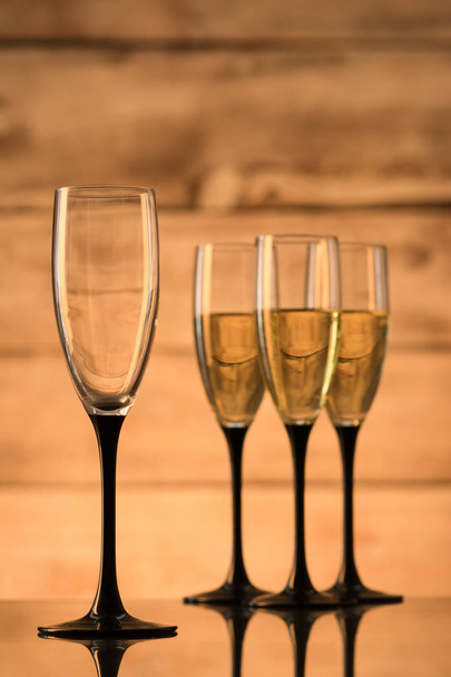 Glasses with champagne and empty glasses - Photo, Image